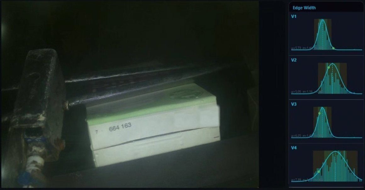 Pantalla de Nadir inspeccionando el fondo de un envase de cartón, con histogramas de medida